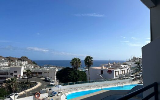 Estudio con vistas al mar, piscina y plaza de aparcamiento
