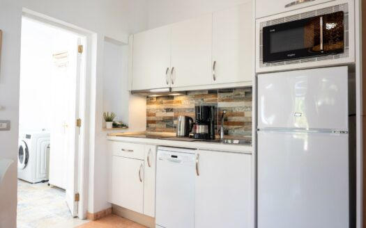 A charming bungalow in a quiet complex next to the golf course